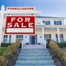 Foreclosures and Shorts Right Facing Foreclosure For Sale Sign in Front of House