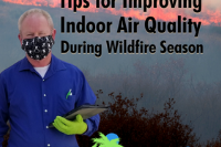 Appraiser With Mask and Fire on Mountain in Background