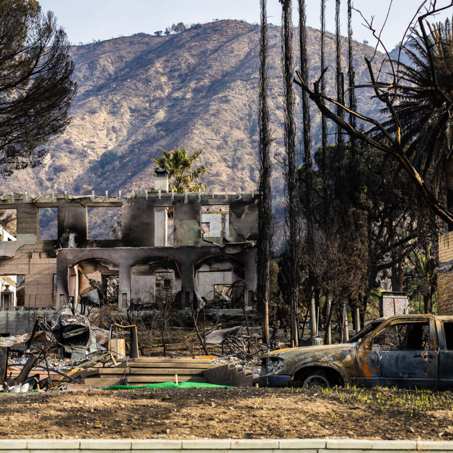 Altadena home burnt down from the Eaton fires with San Gabriel mountains also burnt in the background.